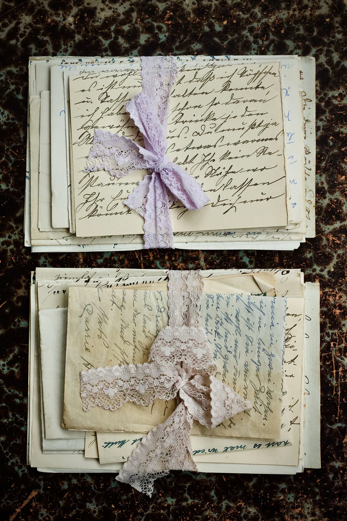 A stack of old letters tied with ribbon